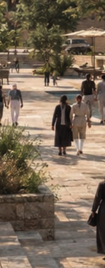 People walking through the landscaped streets